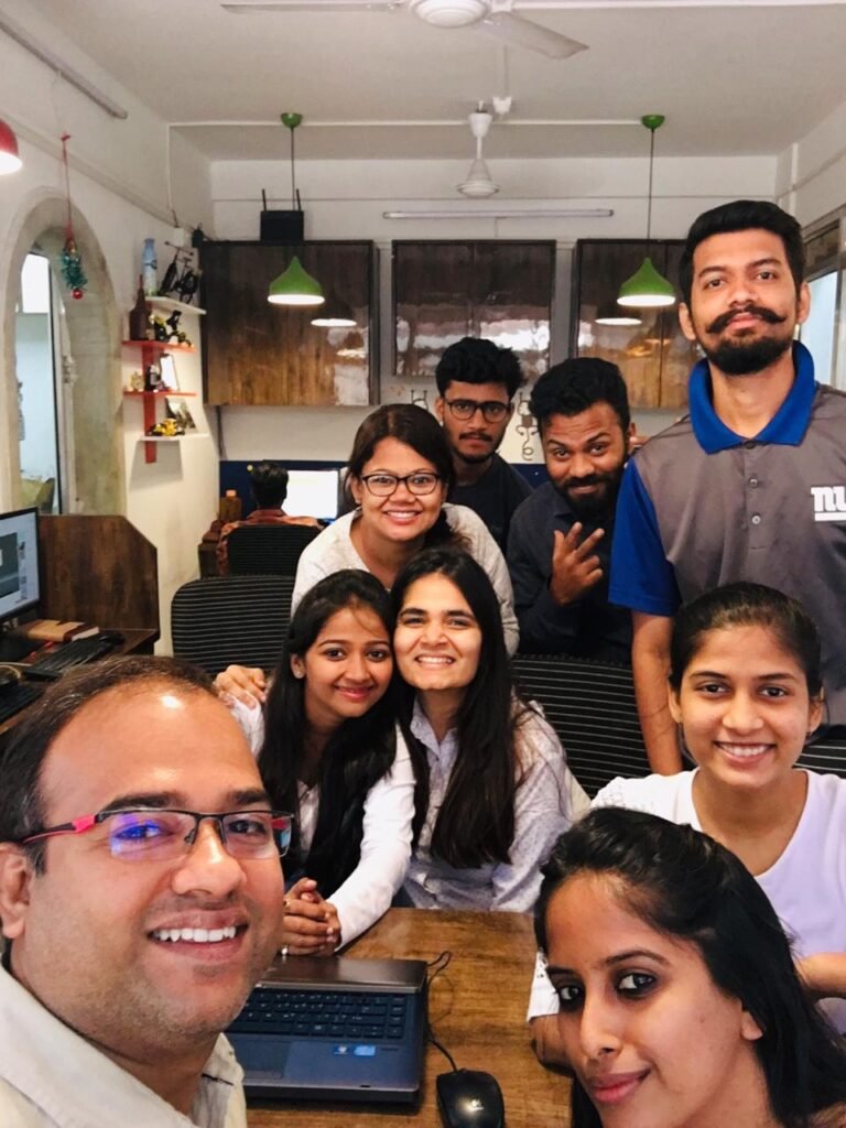 A group of people posing for a photo in an office at a digital marketing institute in Mumbai